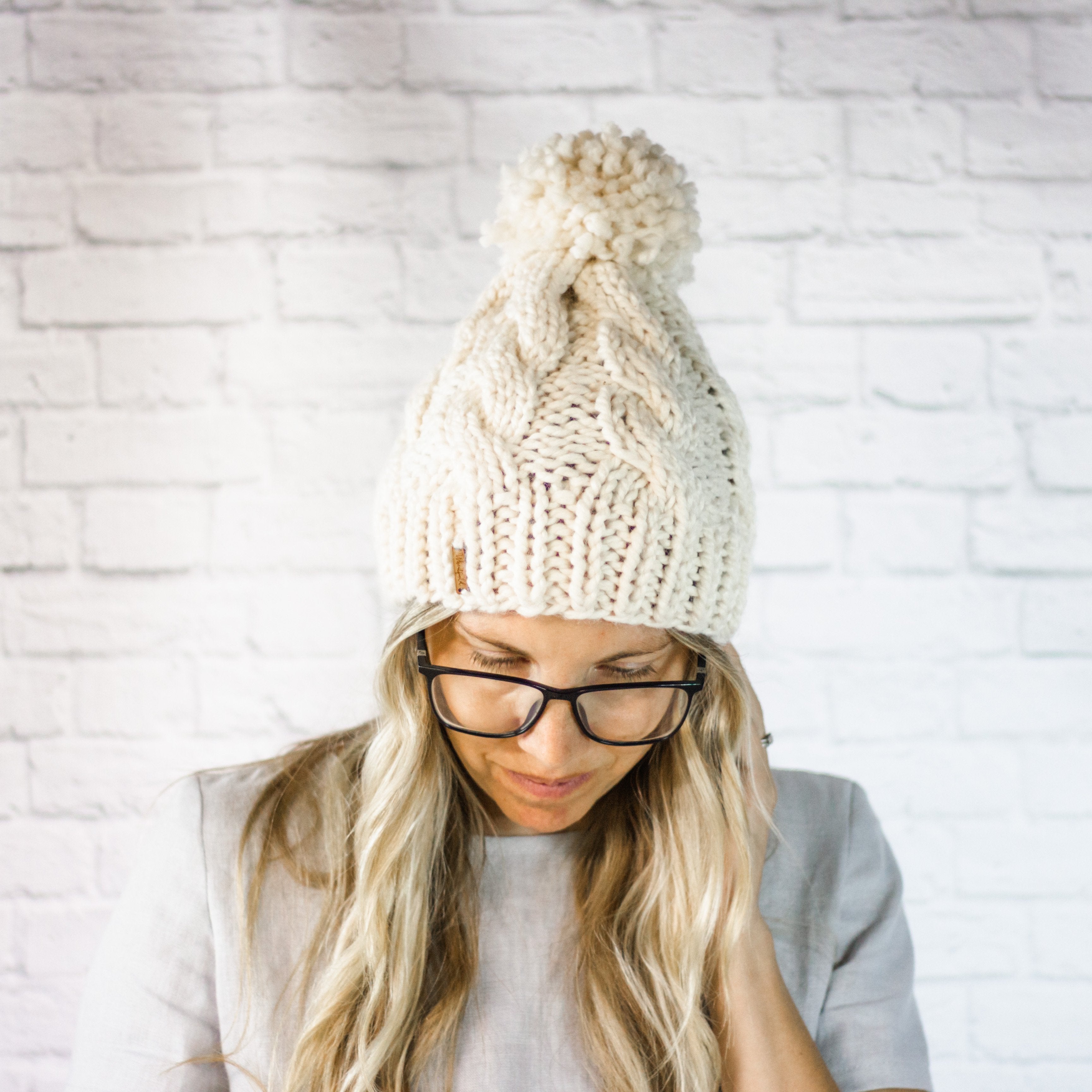 Cream hat cheap with pom pom